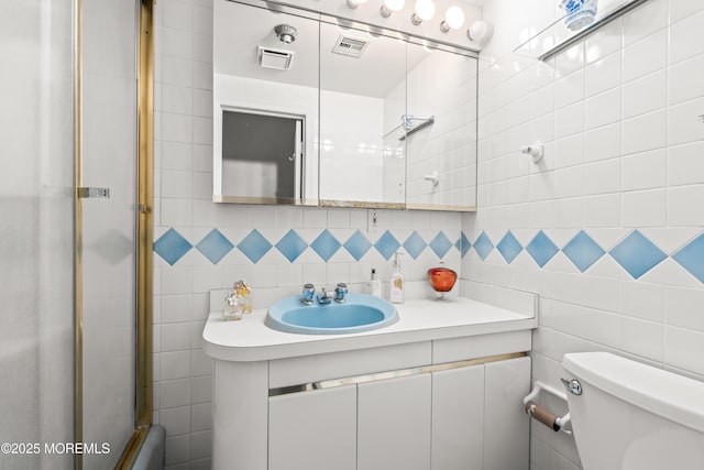 7 Wallace Ave, Oakhurst, NJ 07755 - bathroom with tile walls, vanity, and an enclosed shower