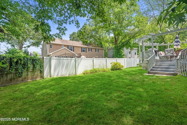 7 Wallace Ave, Oakhurst, NJ 07755 - fenced backyard with a wooden deck, a pergola, and stairway