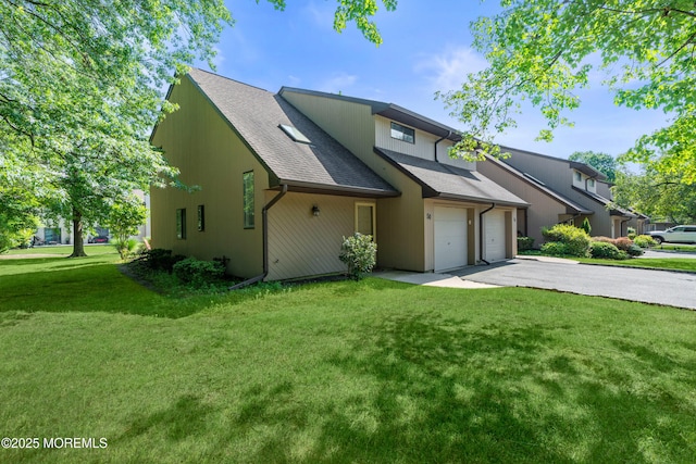 50 Lenape Trl, Tinton Falls, NJ 07724 - view of front of home with asphalt driveway, a shingled roof, an attached garage, and a front lawn