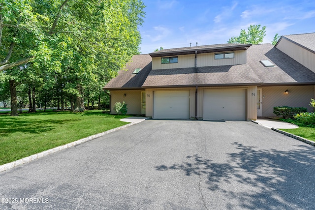 50 Lenape Trl, Tinton Falls, NJ 07724 - view of front facade featuring driveway, a shingled roof, and a front lawn