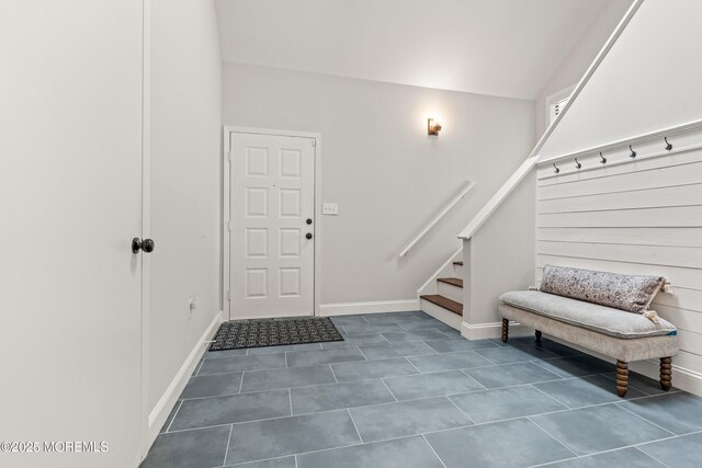 50 Lenape Trl, Tinton Falls, NJ 07724 - foyer entrance with dark tile patterned floors and stairs