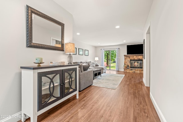 50 Lenape Trl, Tinton Falls, NJ 07724 - living area featuring wood finished floors, a fireplace, and recessed lighting