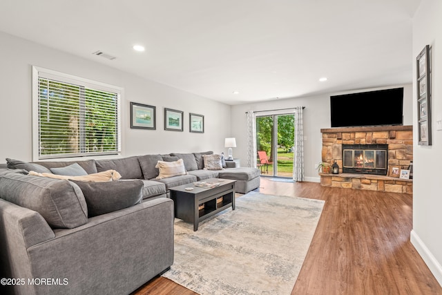 50 Lenape Trl, Tinton Falls, NJ 07724 - living area with wood finished floors, a stone fireplace, and recessed lighting