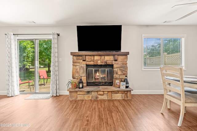 50 Lenape Trl, Tinton Falls, NJ 07724 - living room featuring wood finished floors and a stone fireplace