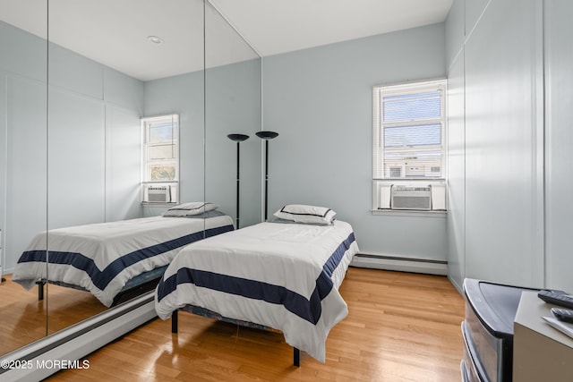 460 Runyan Ave, Deal, NJ 07723 - bedroom featuring a baseboard radiator, cooling unit, and light wood-style floors