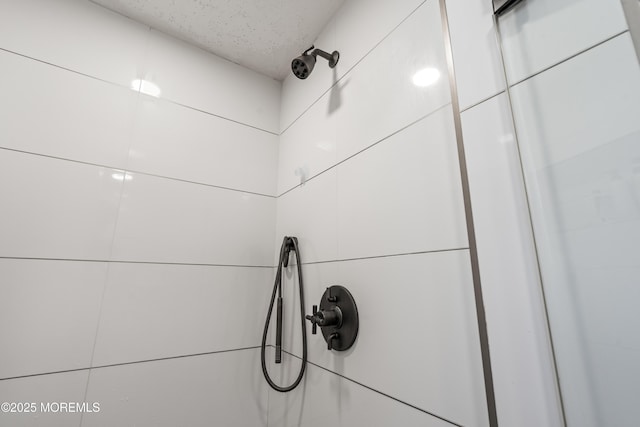 460 Runyan Ave, Deal, NJ 07723 - bathroom view of a tile shower and a textured ceiling
