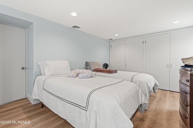 460 Runyan Ave, Deal, NJ 07723 - bedroom featuring two closets, light wood-style floors, and recessed lighting