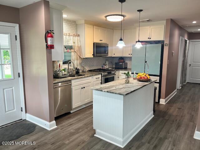 304 Palmer Ave, Neptune Township, NJ 07753 - kitchen with appliances with stainless steel finishes, white cabinets, dark wood-style floors, and recessed lighting