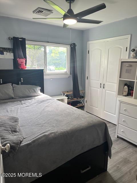 304 Palmer Ave, Neptune Township, NJ 07753 - bedroom featuring light wood-style flooring, a closet, and a ceiling fan