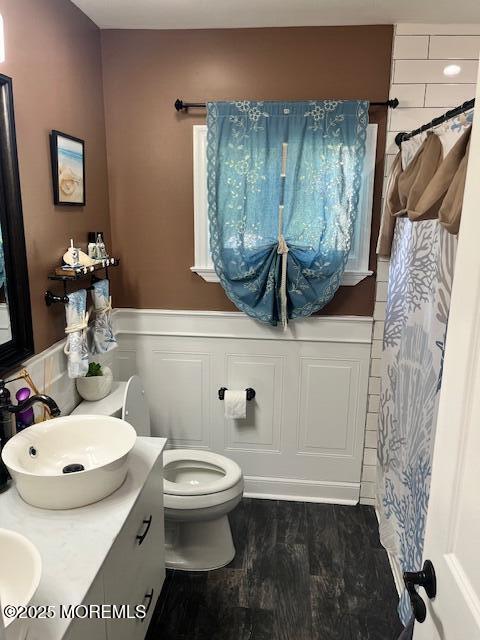 304 Palmer Ave, Neptune Township, NJ 07753 - full bathroom featuring wainscoting, double vanity, wood finished floors, and a shower with shower curtain