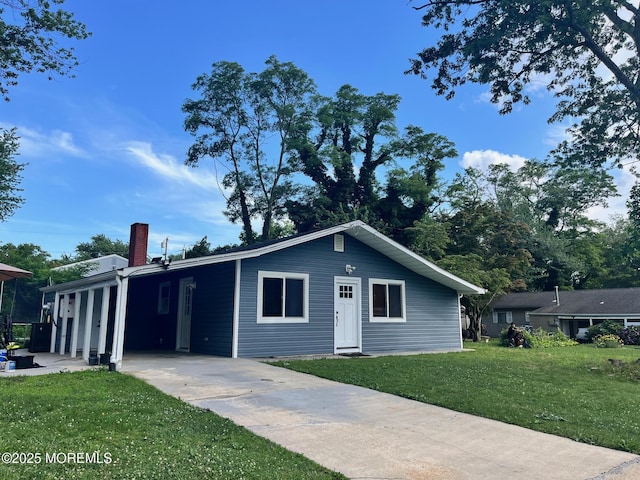 304 Palmer Ave, Neptune Township, NJ 07753 - ranch-style house with concrete driveway, a front lawn, a chimney, and a carport