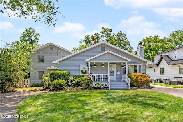 3 Sutphin Ave, Matawan, NJ 07747 - view of front of property featuring covered porch, a front lawn, and a chimney