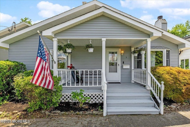 3 Sutphin Ave, Matawan, NJ 07747 - bungalow featuring a chimney and covered porch