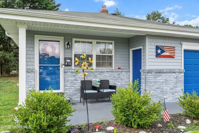 410 Jamaica Blvd, Toms River, NJ 08757 - view of exterior entry featuring covered porch and a chimney