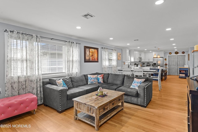 410 Jamaica Blvd, Toms River, NJ 08757 - living room with recessed lighting, ornamental molding, and light wood-type flooring
