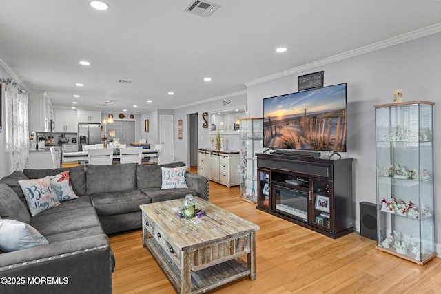 410 Jamaica Blvd, Toms River, NJ 08757 - living room featuring ornamental molding, recessed lighting, and light wood finished floors