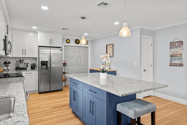 410 Jamaica Blvd, Toms River, NJ 08757 - kitchen with appliances with stainless steel finishes, light wood-style flooring, a breakfast bar, white cabinets, and recessed lighting