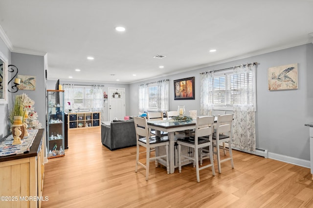 410 Jamaica Blvd, Toms River, NJ 08757 - dining area with crown molding, light wood finished floors, recessed lighting, and baseboard heating
