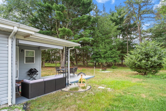 410 Jamaica Blvd, Toms River, NJ 08757 - view of grassy yard with an outdoor living space, a patio, and view of wooded area