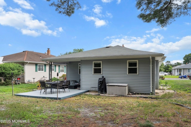 410 Jamaica Blvd, Toms River, NJ 08757 - back of property with a patio area and a lawn