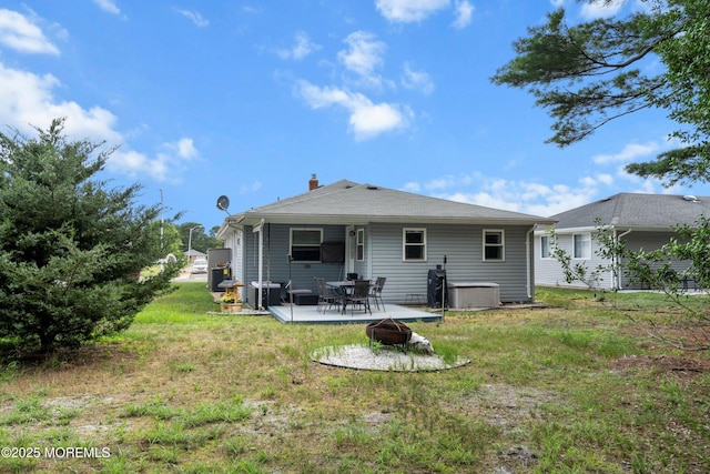 410 Jamaica Blvd, Toms River, NJ 08757 - rear view of house with a fire pit, a patio area, a chimney, and a lawn