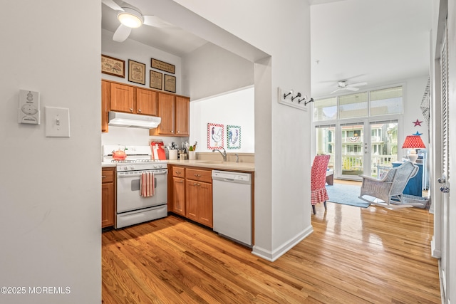 4 Ocean Ave Unit 5, Ocean Grove, NJ 07756 - kitchen featuring white appliances, a ceiling fan, under cabinet range hood, light wood-style floors, and light countertops