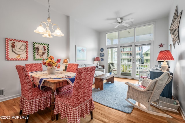 4 Ocean Ave Unit 5, Ocean Grove, NJ 07756 - dining room featuring a chandelier, a ceiling fan, wood finished floors, and a towering ceiling
