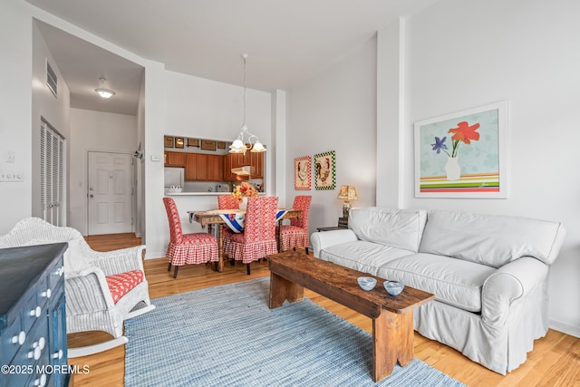4 Ocean Ave Unit 5, Ocean Grove, NJ 07756 - living room featuring light wood-style floors and a high ceiling