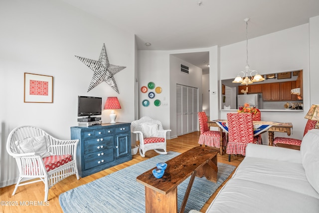 4 Ocean Ave Unit 5, Ocean Grove, NJ 07756 - living area with a chandelier and light wood-type flooring