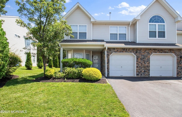 9 Nutmeg Ct, Tinton Falls, NJ 07753 - view of property featuring driveway, a garage, and a front yard
