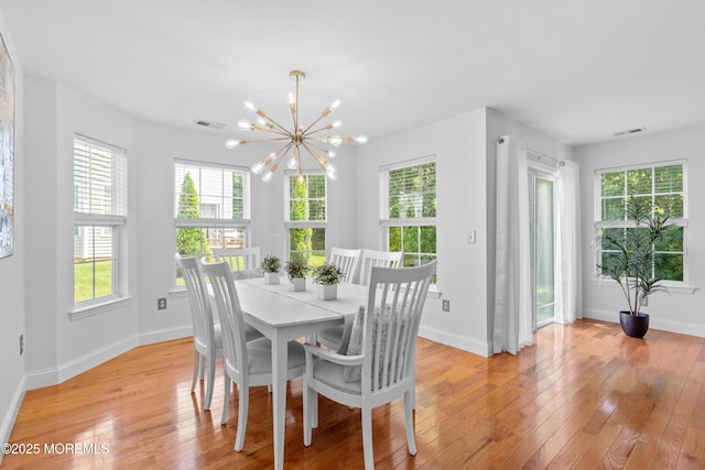 9 Nutmeg Ct, Tinton Falls, NJ 07753 - dining area with a chandelier and plenty of natural light
