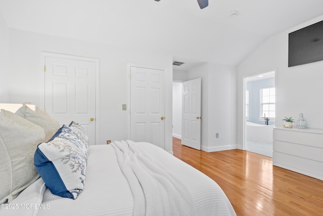 9 Nutmeg Ct, Tinton Falls, NJ 07753 - bedroom with light wood-style flooring, vaulted ceiling, ensuite bath, and a ceiling fan