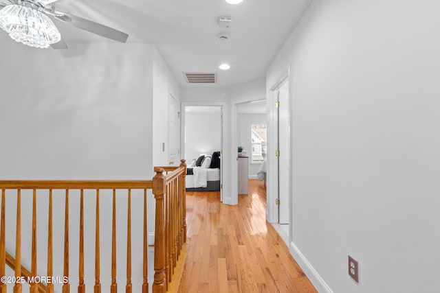 9 Nutmeg Ct, Tinton Falls, NJ 07753 - corridor with an upstairs landing, light wood finished floors, and recessed lighting