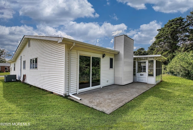 163 Courtshire Dr, Brick, NJ 08723 - back of house with a sunroom, a yard, a patio area, and a chimney