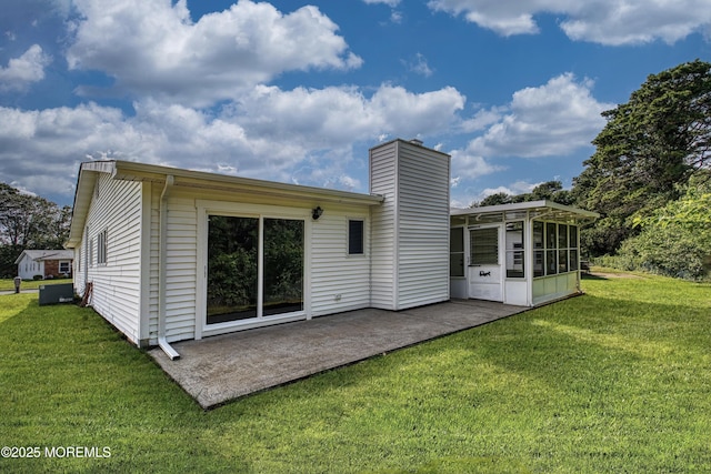 163 Courtshire Dr, Brick, NJ 08723 - back of house featuring a patio, a sunroom, a yard, and a chimney
