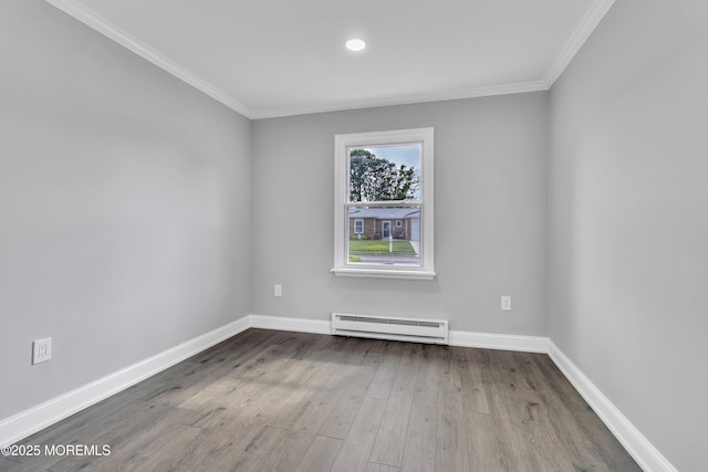 163 Courtshire Dr, Brick, NJ 08723 - spare room featuring baseboard heating, crown molding, and dark wood finished floors
