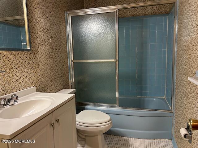 1599 Woodcrest Dr, Toms River, NJ 08753 - bathroom featuring vanity, tile patterned flooring, and combined bath / shower with glass door