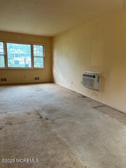 1599 Woodcrest Dr, Toms River, NJ 08753 - unfurnished room with carpet floors and a wall mounted AC