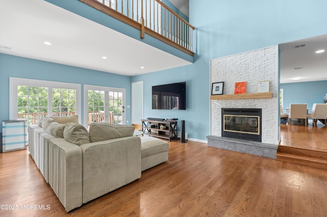 2262 Allenwood Rd, Allenwood, NJ 08720 - living area featuring a stone fireplace, wood finished floors, recessed lighting, and a towering ceiling