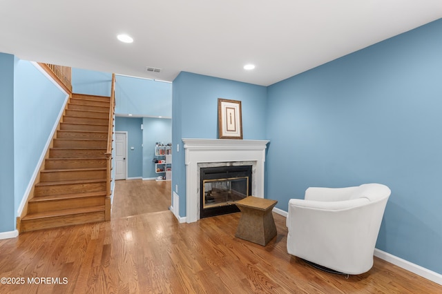 2262 Allenwood Rd, Allenwood, NJ 08720 - sitting room featuring stairs, wood finished floors, a glass covered fireplace, and recessed lighting