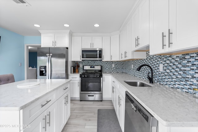 2262 Allenwood Rd, Allenwood, NJ 08720 - kitchen featuring stainless steel appliances, light stone counters, white cabinets, backsplash, and recessed lighting