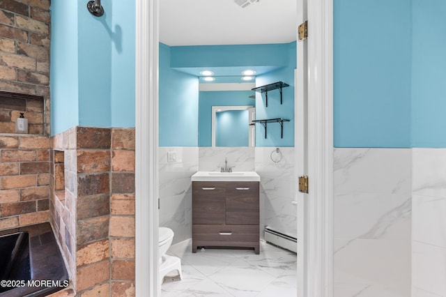 2262 Allenwood Rd, Allenwood, NJ 08720 - bathroom with baseboard heating, tile walls, vanity, wainscoting, and marble look tile flooring