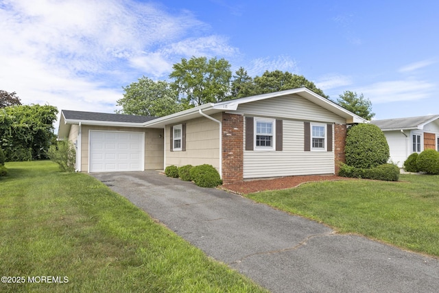117 Clay Cir, Brick, NJ 08724 - ranch-style house with an attached garage, driveway, and a front lawn