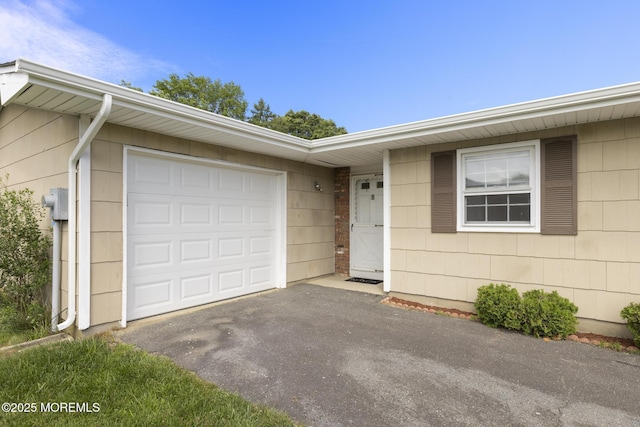 117 Clay Cir, Brick, NJ 08724 - view of front of property with an attached garage and asphalt driveway