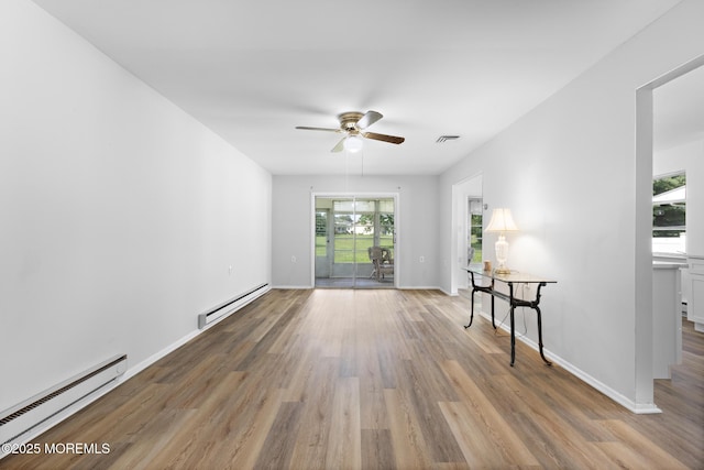 117 Clay Cir, Brick, NJ 08724 - spare room with a baseboard radiator, ceiling fan, and wood finished floors