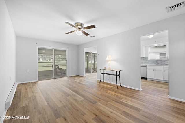 117 Clay Cir, Brick, NJ 08724 - unfurnished room with a ceiling fan, baseboard heating, and light wood finished floors