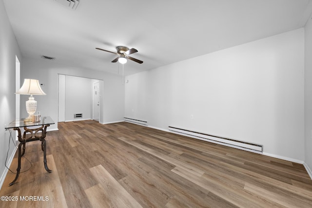117 Clay Cir, Brick, NJ 08724 - unfurnished room with a baseboard heating unit, a ceiling fan, and wood finished floors