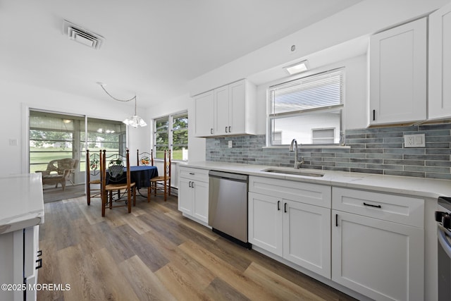 117 Clay Cir, Brick, NJ 08724 - kitchen featuring dishwasher, wood finished floors, a chandelier, and white cabinets