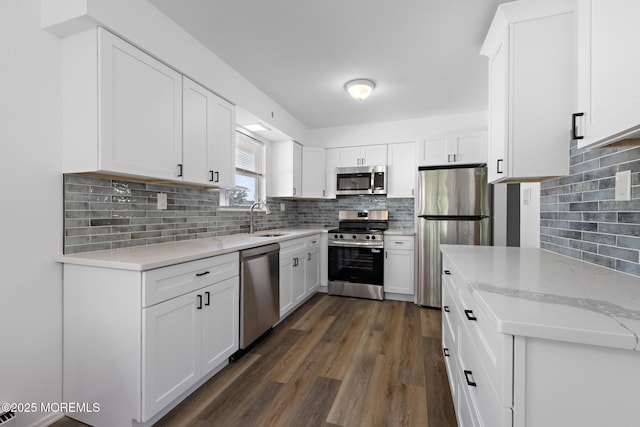 117 Clay Cir, Brick, NJ 08724 - kitchen with stainless steel appliances, backsplash, dark wood finished floors, and white cabinets