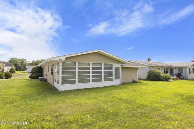 117 Clay Cir, Brick, NJ 08724 - rear view of house with a lawn and an attached garage